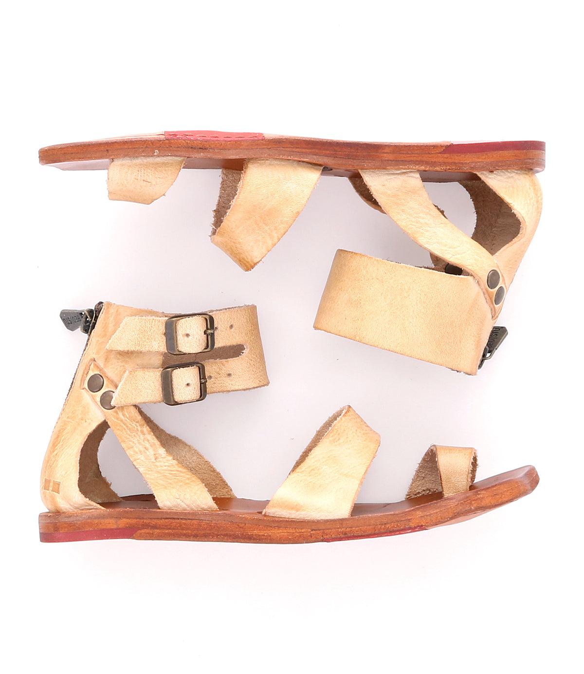 A pair of Bed Stu sandals with straps and buckles on a white background.