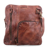 A Bed Stu Aiken brown leather crossbody bag with a zippered compartment.