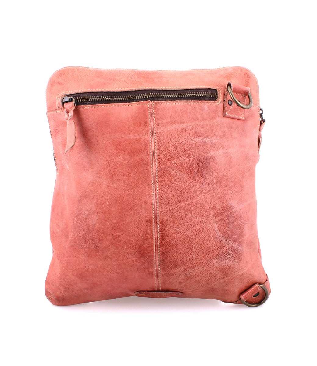 A Bed Stu Aiken pink leather crossbody bag with a zipper.