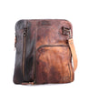 A Bed Stu Aiken, a brown leather crossbody bag with a zipper.