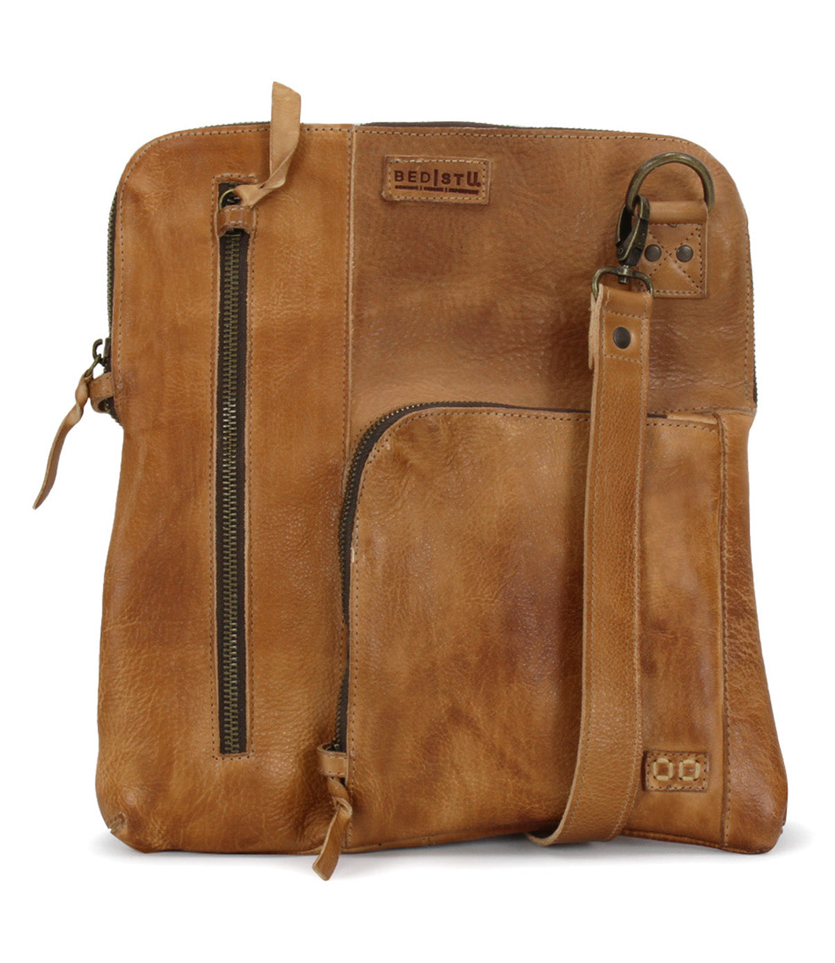 A Bed Stu Aiken tan leather cross body bag with a zipper.