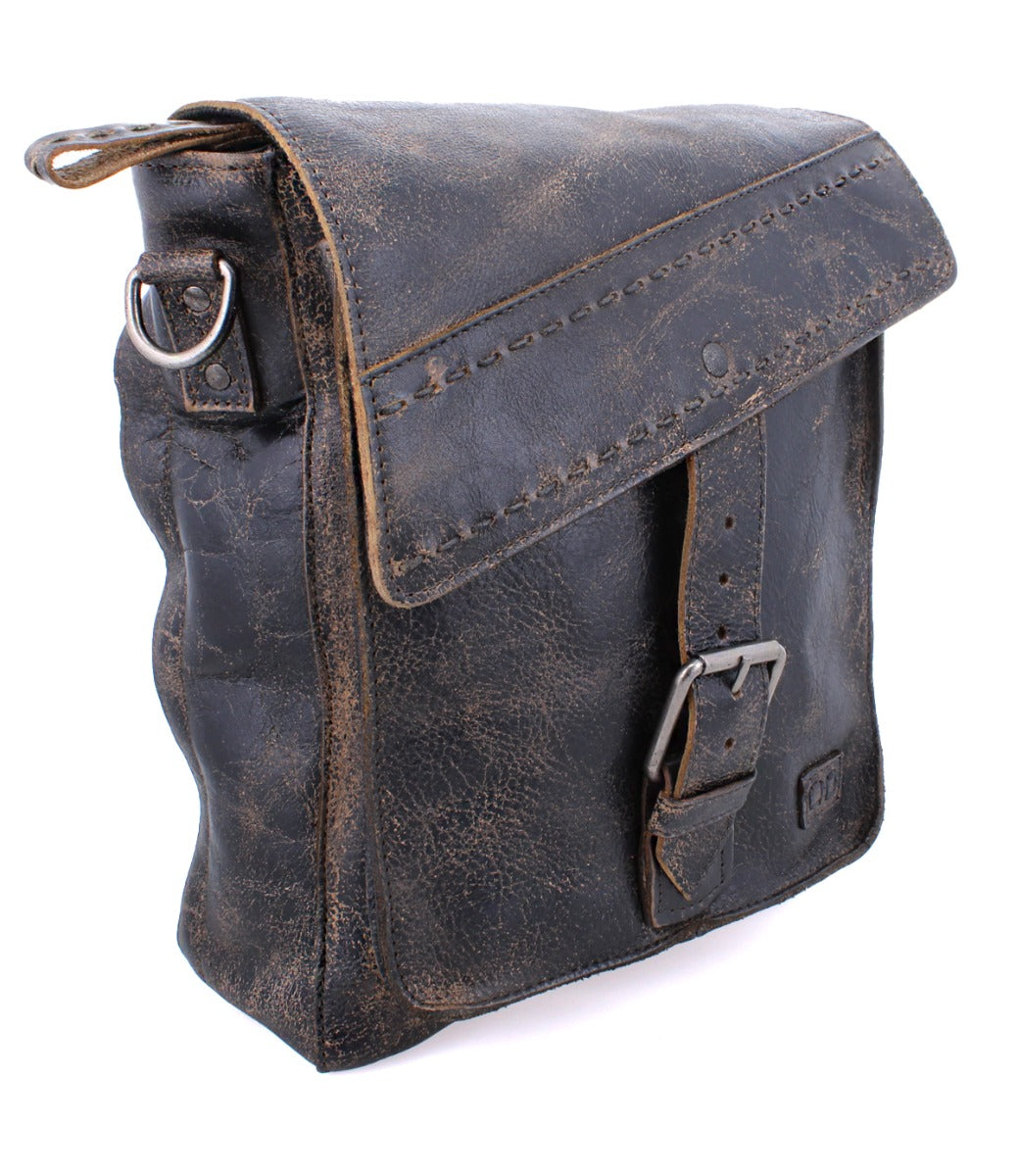 A Bed Stu Ainhoa black leather messenger bag with an adjustable and removable strap for a crossbody handbag style, featuring a buckle closure.