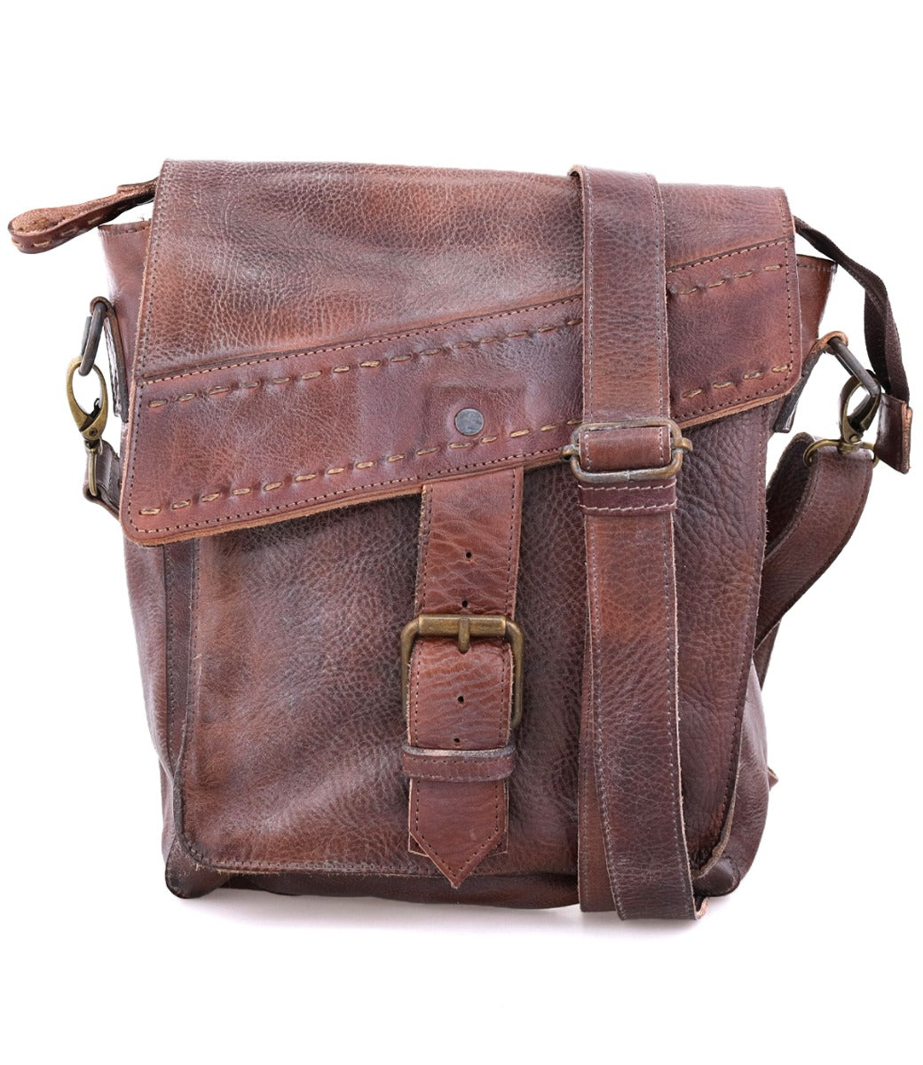 A Bed Stu Ainhoa brown leather messenger bag with an adjustable strap and zip-top closure.