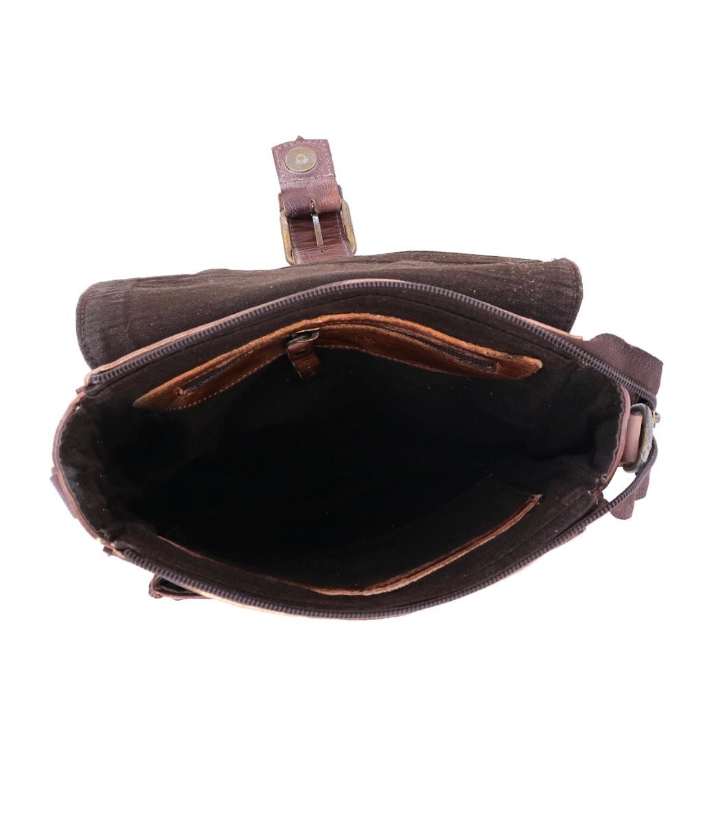 Top view of an open, empty Bed Stu Ainhoa LTC brown canvas waist bag with zipper and adjustable leather strap, isolated on a white background.