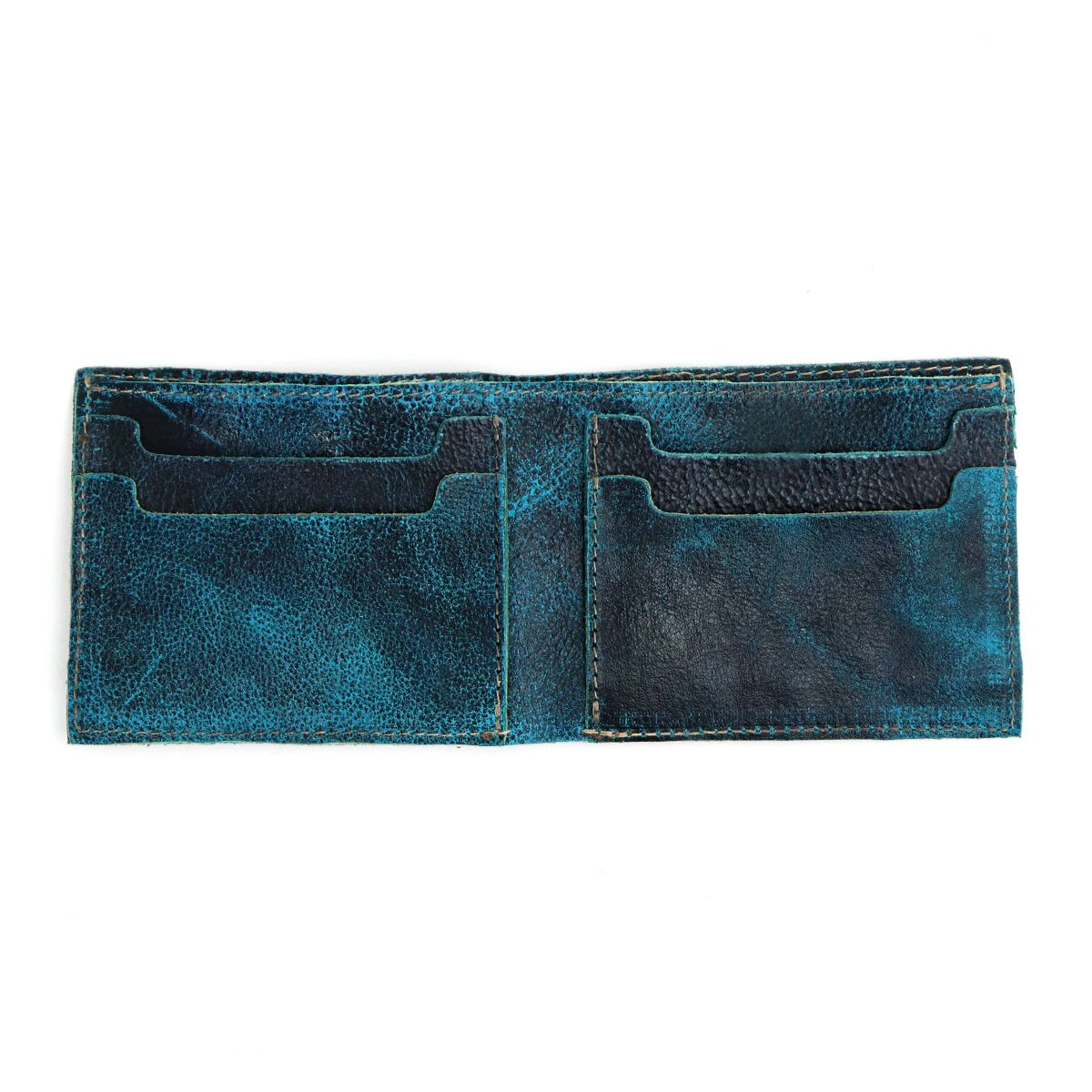 The Amidala wallet by Bed Stu in dark teal opens to reveal multiple card slots and a dedicated space for cash and cards.