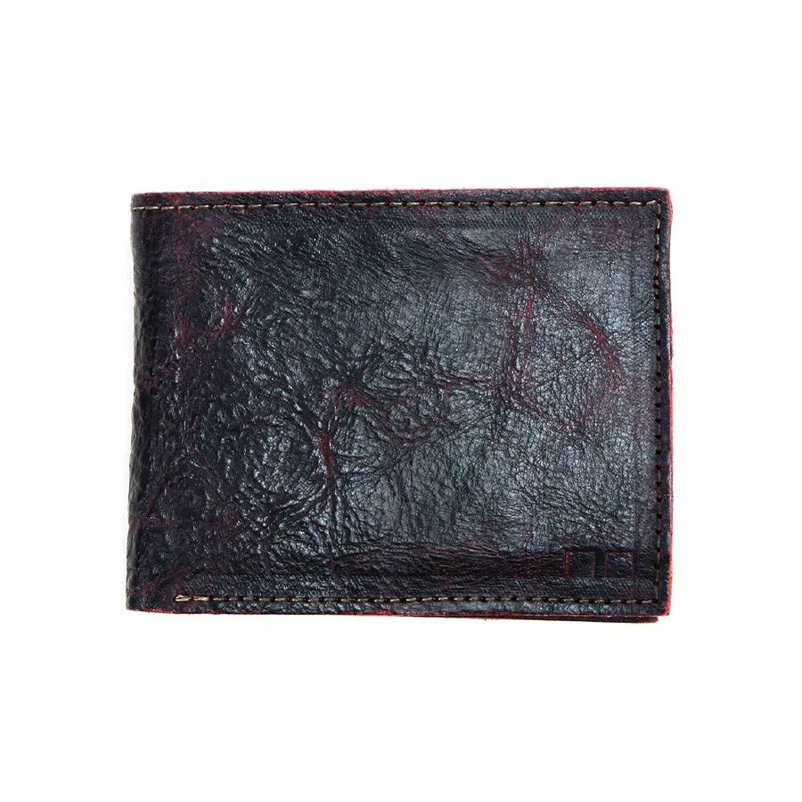 The Amidala wallet by Bed Stu, a well-loved black bifold perfect for storing cash and cards, is closed and positioned against a white background.