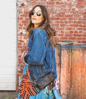A woman wearing Bed Stu Amina purse.