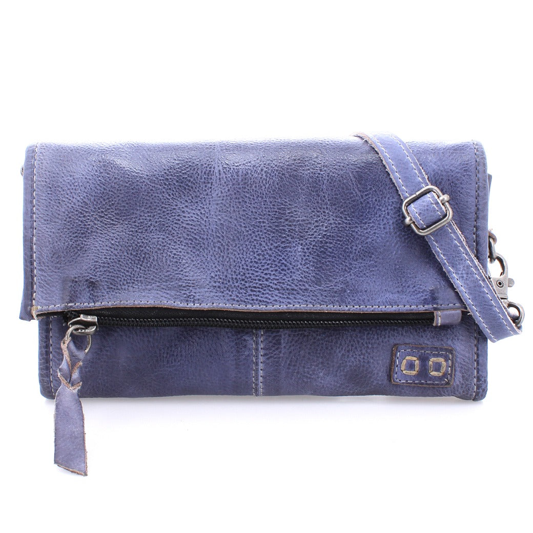 A blue leather Amina clutch bag with an adjustable strap by Bed Stu.