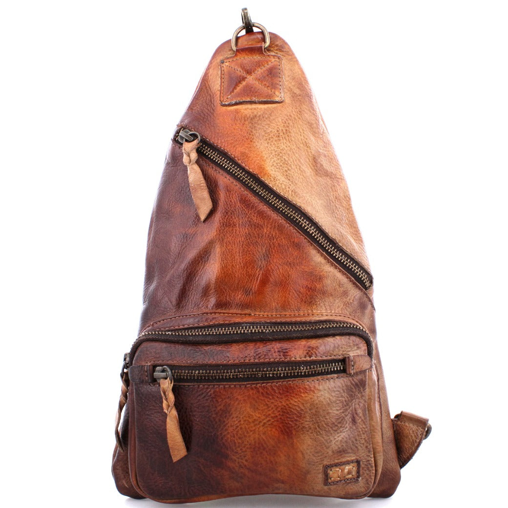 A brown leather Andie backpack with two zippers. Brand name: Bed Stu.