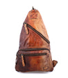 A brown leather Andie backpack with two zippers. Brand name: Bed Stu.