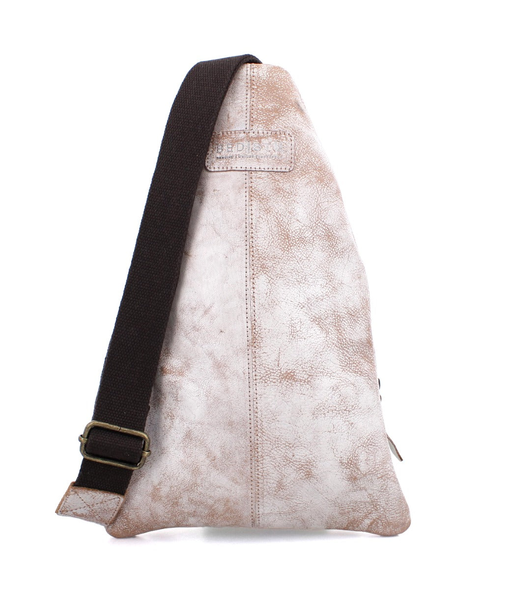 A white Andie sling bag with brown straps from Bed Stu.