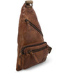 A brown leather Andie sling bag on a white background by Bed Stu.