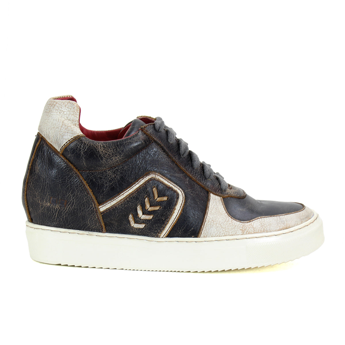 Side view of the Andromeda, a street-smart high-top sneaker from Bed Stu in black and white leather with brown accents, featuring a white rubber sole, chevron design on the side, and a hidden heel.