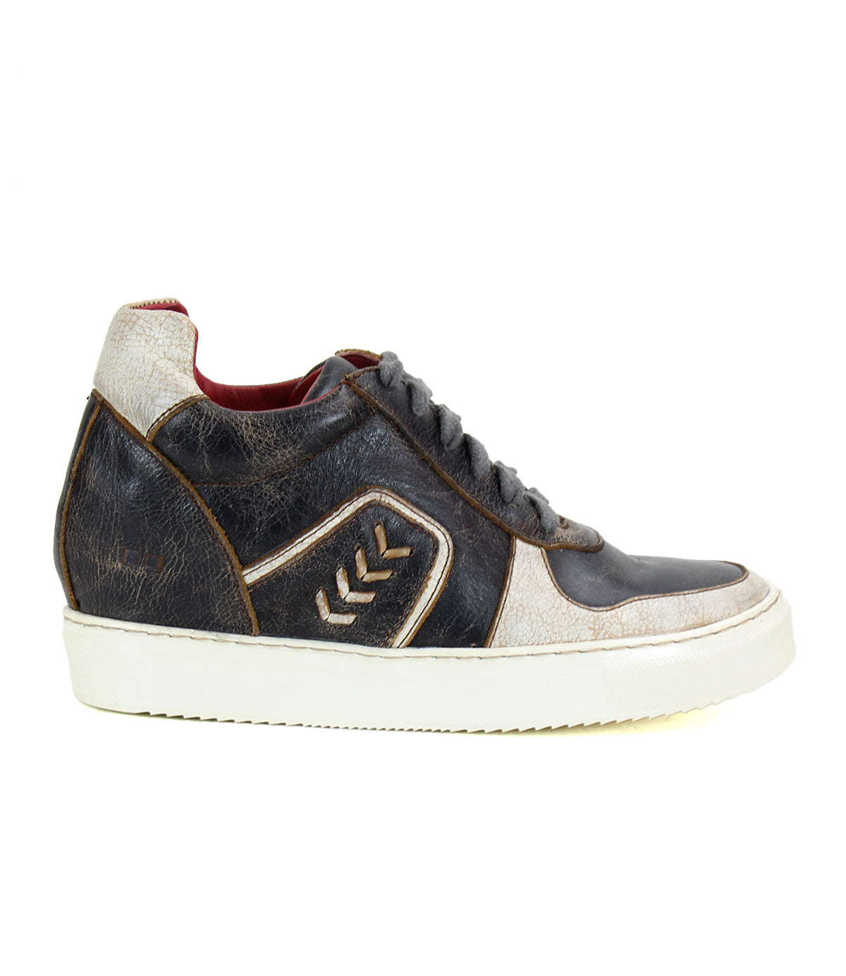 Side view of the Andromeda, a street-smart high-top sneaker from Bed Stu in black and white leather with brown accents, featuring a white rubber sole, chevron design on the side, and a hidden heel.
