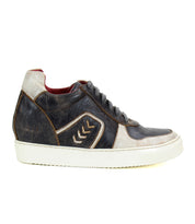 Side view of the Andromeda, a street-smart high-top sneaker from Bed Stu in black and white leather with brown accents, featuring a white rubber sole, chevron design on the side, and a hidden heel.