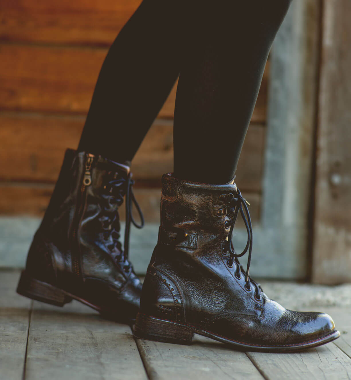 A woman wearing Anne boots by Bed Stu on a wooden floor.