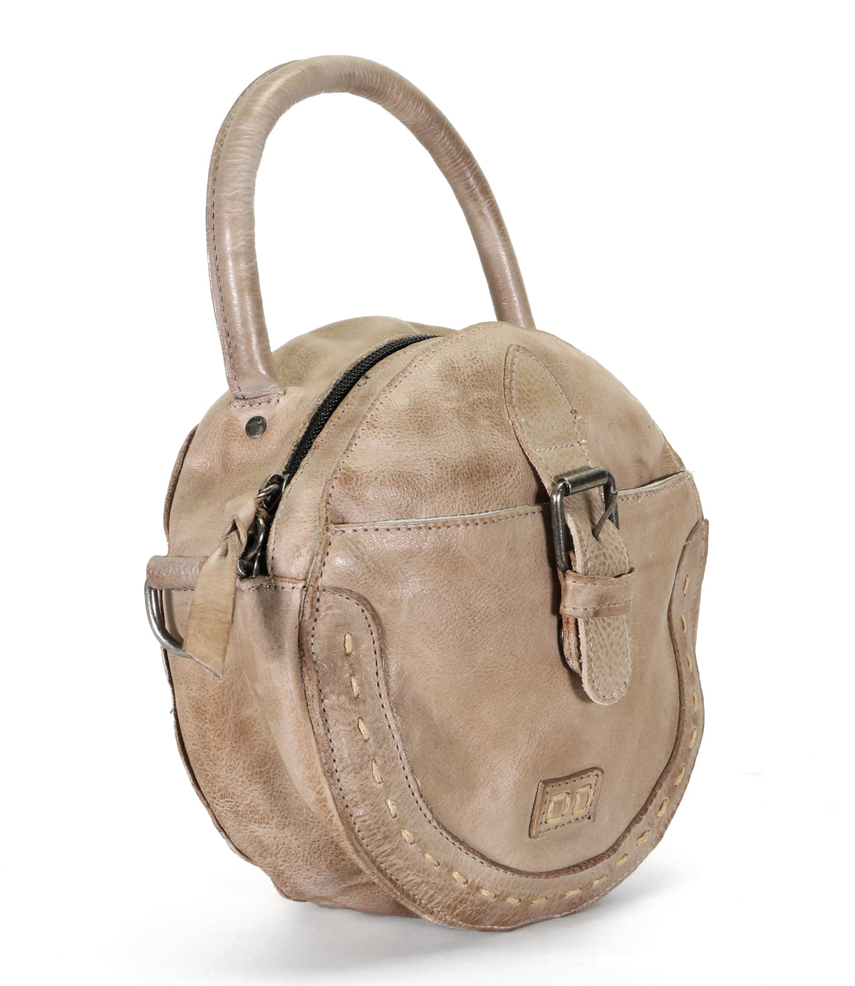A beige leather Bed Stu Arenfield handbag with a strap and buckle.