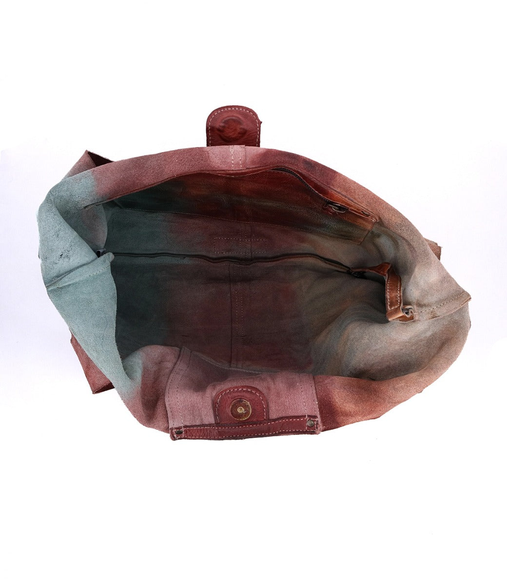 The inside of a Ariel bag with a pink, blue, and green color. Brand Name: Bed Stu
