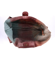 The inside of a Ariel bag with a pink, blue, and green color. Brand Name: Bed Stu