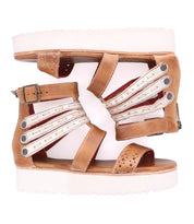 A pair of Artemia sandals with white straps from Bed Stu.