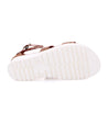 A pair of Bed Stu Artemia women's sandals with white straps and white soles.