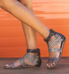 A woman in a pair of Bed Stu Artemis M sandals with straps.