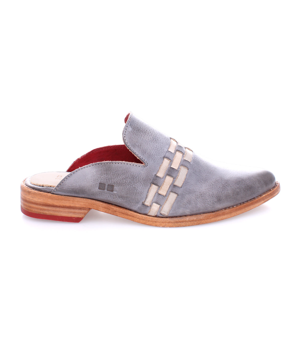 A grey slip on Asenet shoe with a red sole by Bed Stu.