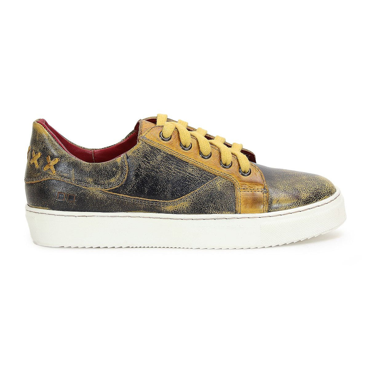 Side view of a worn-out Azeli sneaker in black and yellow with white soles and yellow laces. This low-profile shoe by Bed Stu features a padded collar, rounded toe, visible scuff marks, and a textured, distressed look.