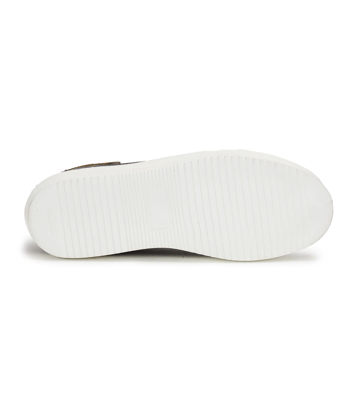 The image showcases the bottom view of the Azeli low-profile sneaker by Bed Stu, featuring a white rubber sole with a textured grip pattern that seamlessly blends style and comfort.