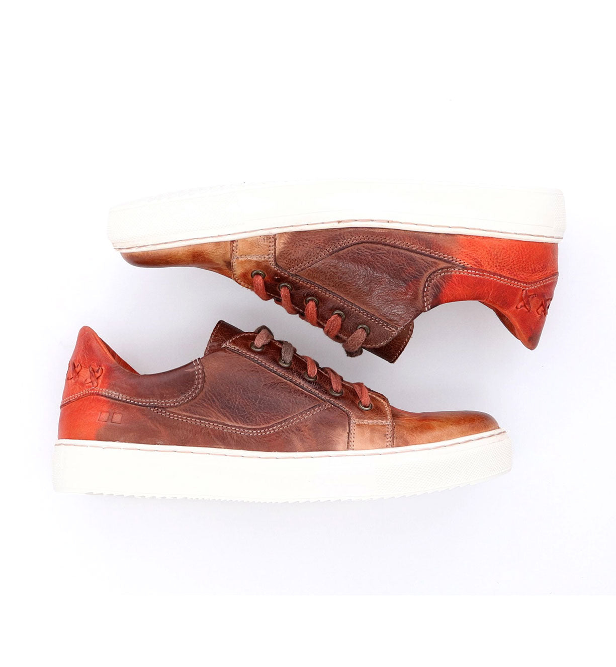 A pair of brown and orange Azeli sneakers by Bed Stu on a white surface.