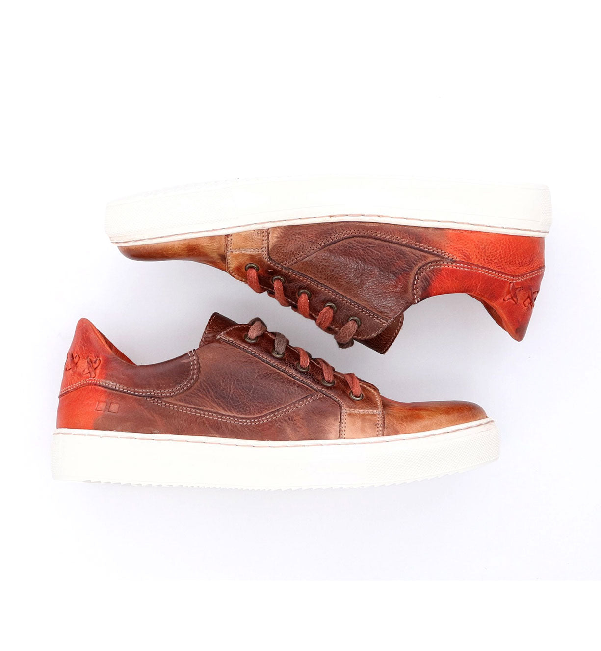A pair of brown and orange Azeli sneakers by Bed Stu on a white surface.