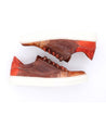 A pair of brown and orange Azeli sneakers by Bed Stu on a white surface.