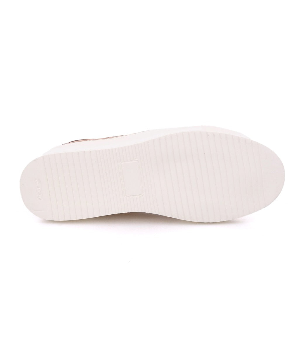 A white Azeli sneaker with white soles on a white background. (Bed Stu)
