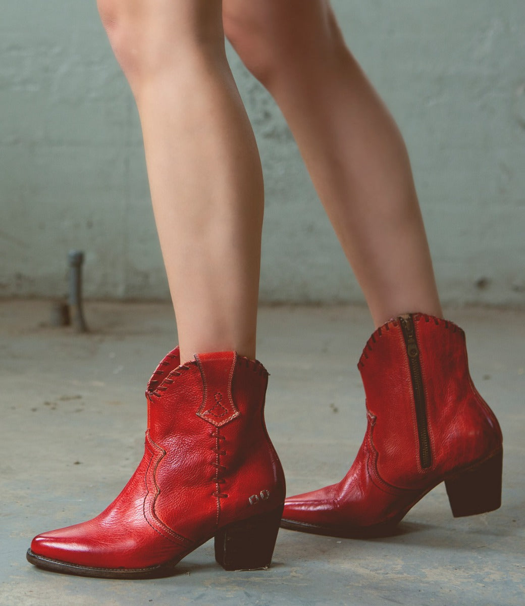 A woman wearing a pair of Baila II by Bed Stu red cowboy boots.