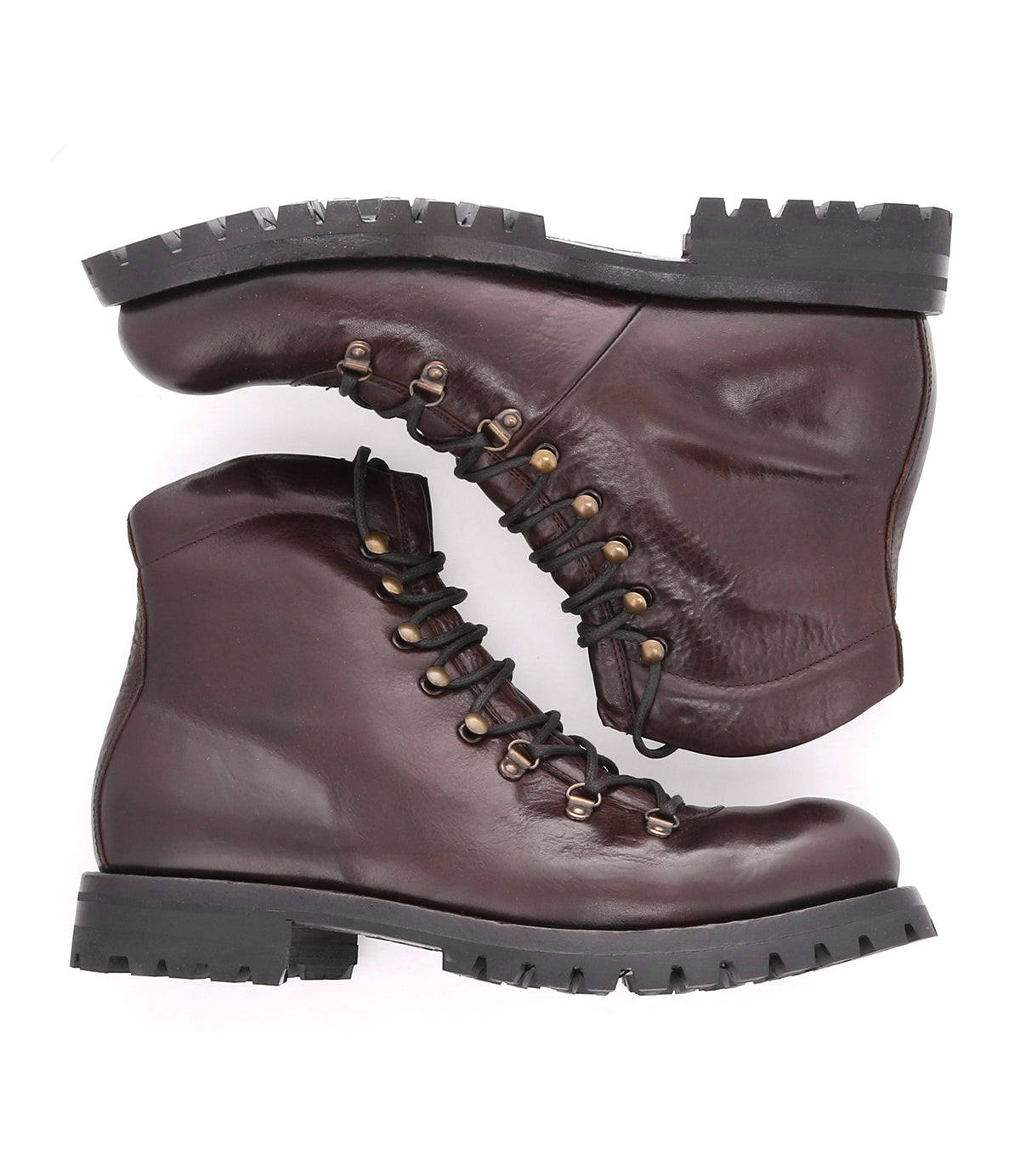 A pair of Bed Stu brown leather hiking boots on a white background.