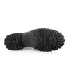 A pair of Bed Stu Barge black rubber shoes on a white background, offering comfort and durability.