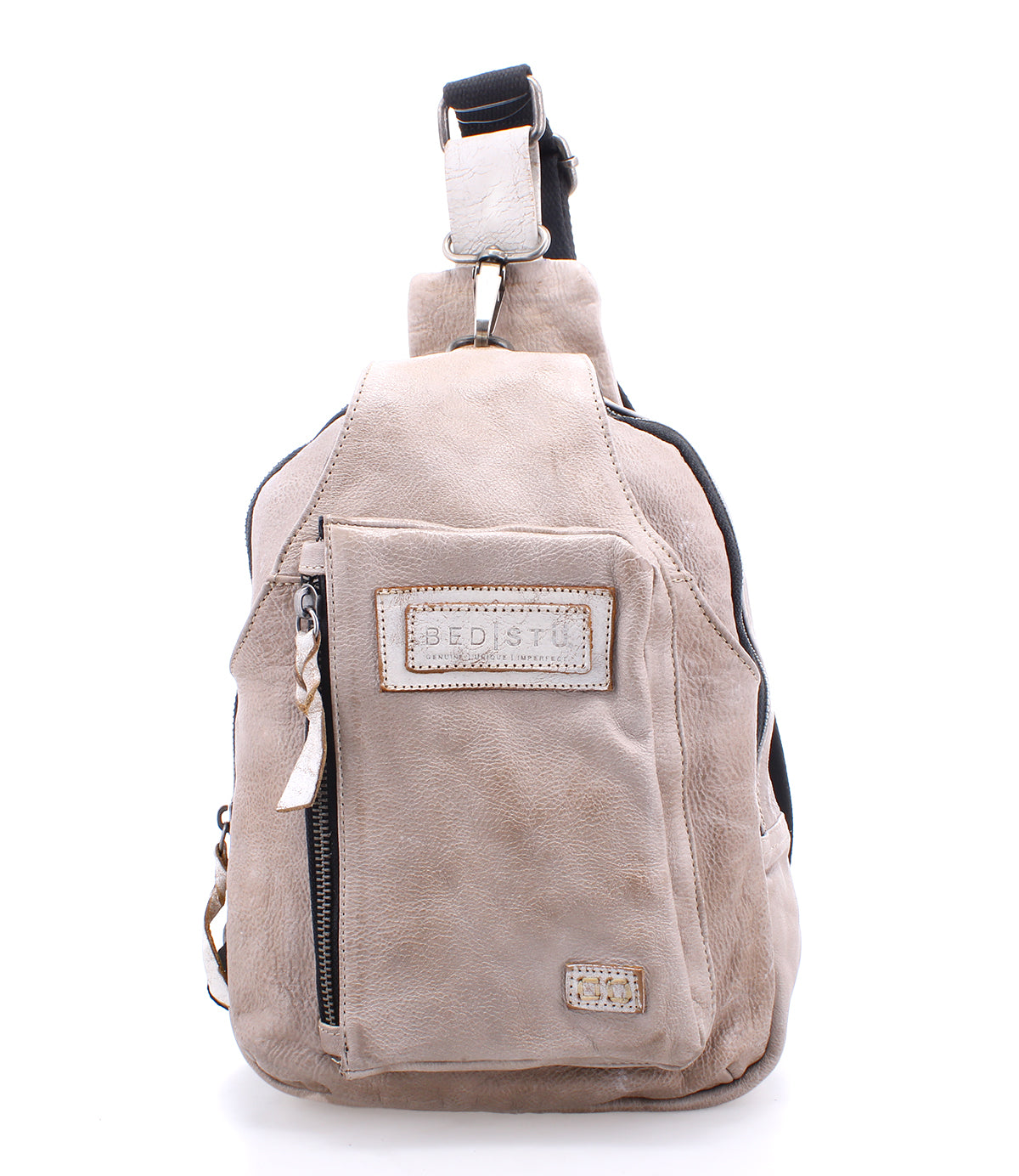 A Beau leather sling backpack with a zipper on the side, perfect for hands-free activities.