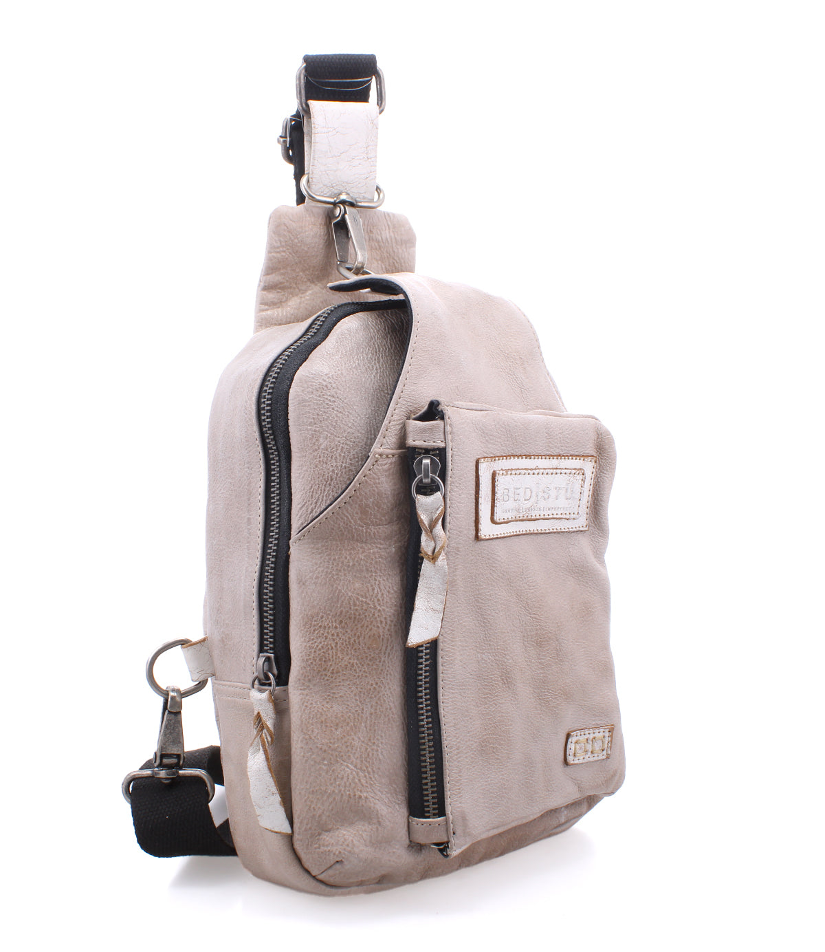 This durable Beau backpack by Bed Stu features a convenient zipper on the side, perfect for hands-free activities.