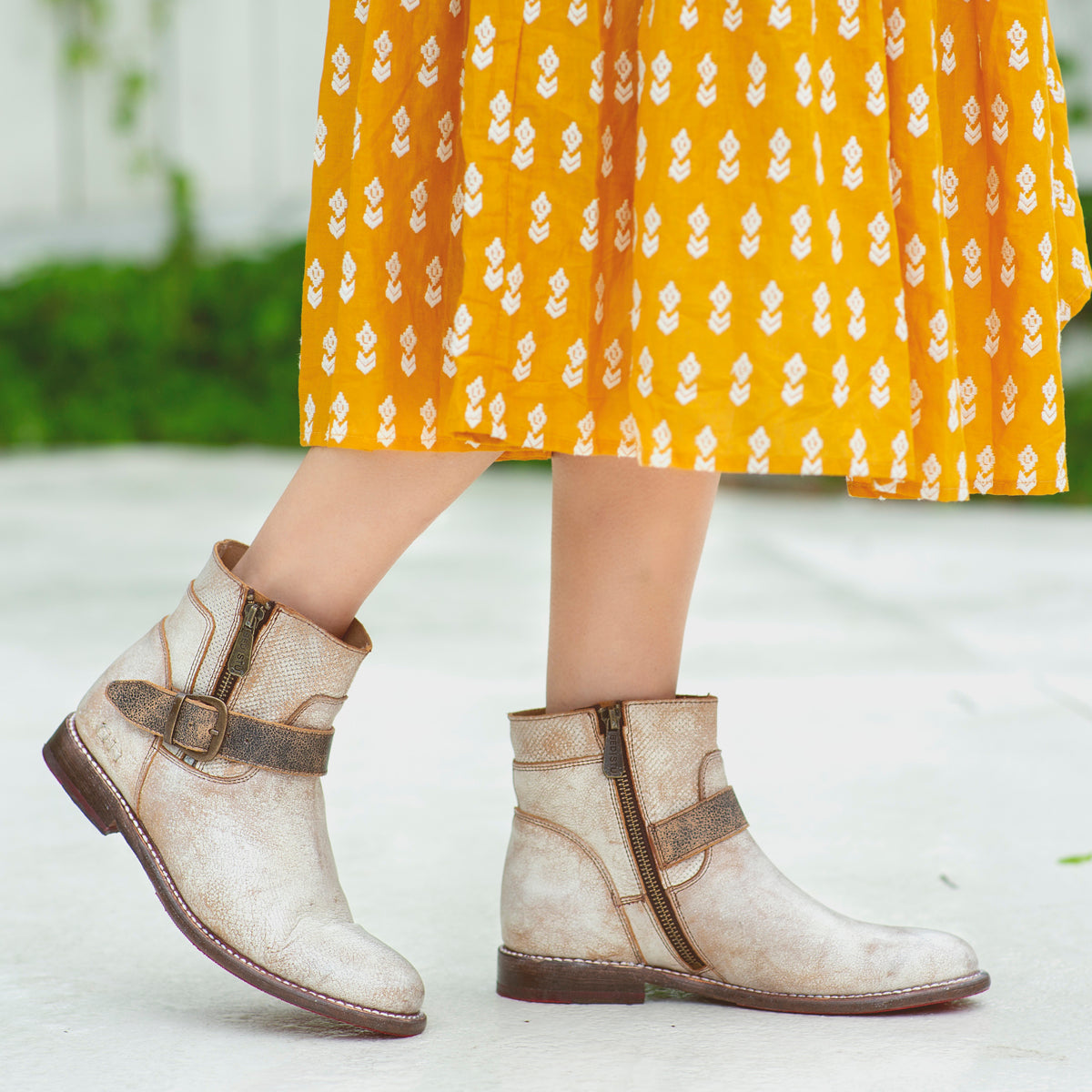 A woman wearing a pair of Bed Stu Becca leather boots.