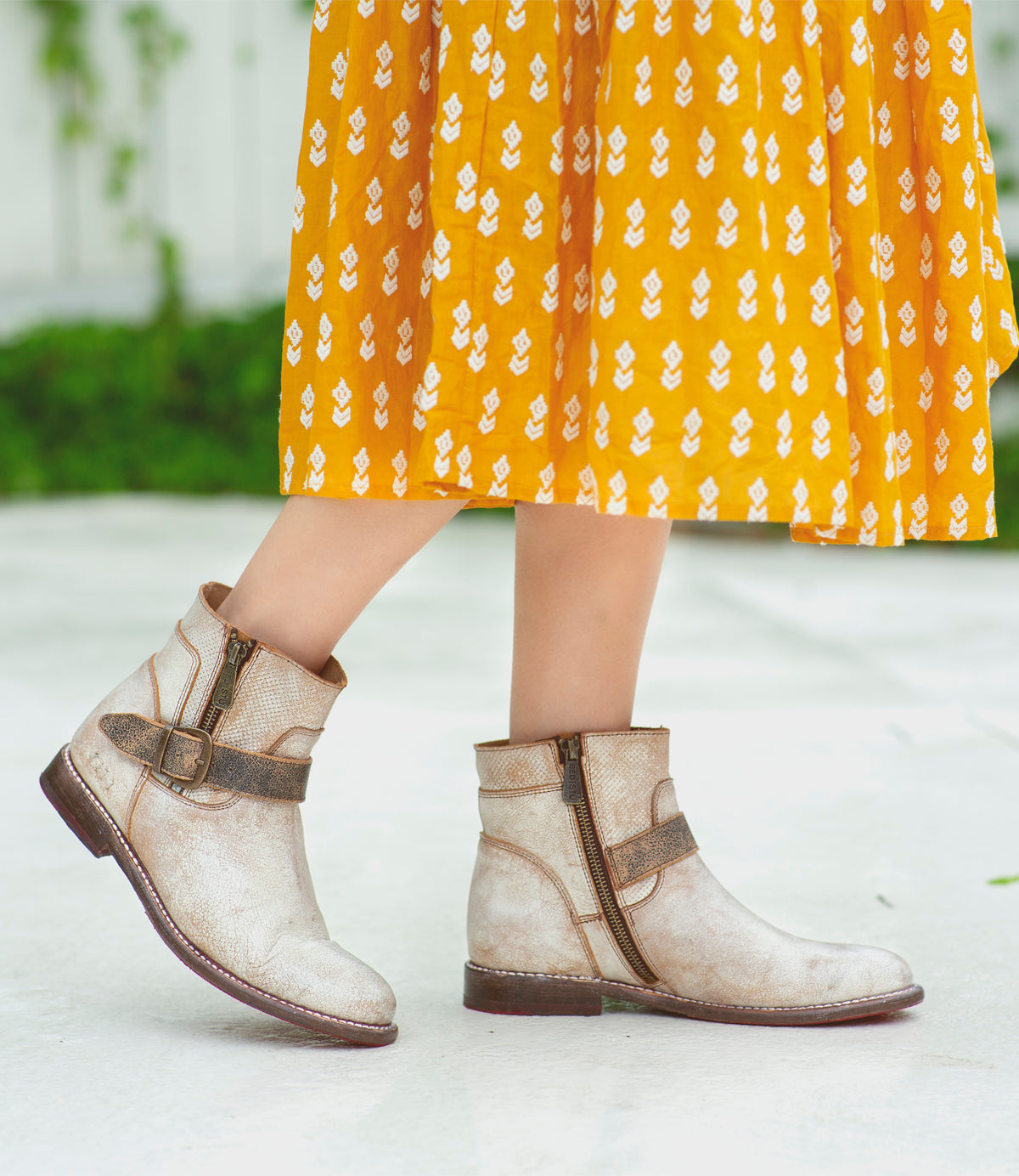 A woman wearing a pair of Bed Stu Becca leather boots.