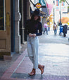 A woman wearing a pair of Bed Stu Becca tan leather boots.