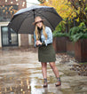 A woman wearing a pair of Bed Stu Becca taupe leather boots.