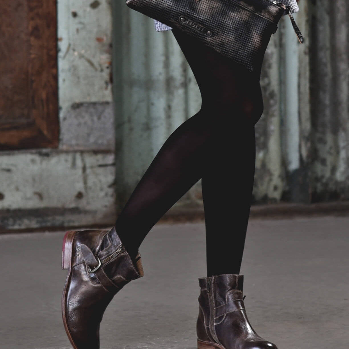 A woman wearing a pair of Bed Stu Becca leather boots.