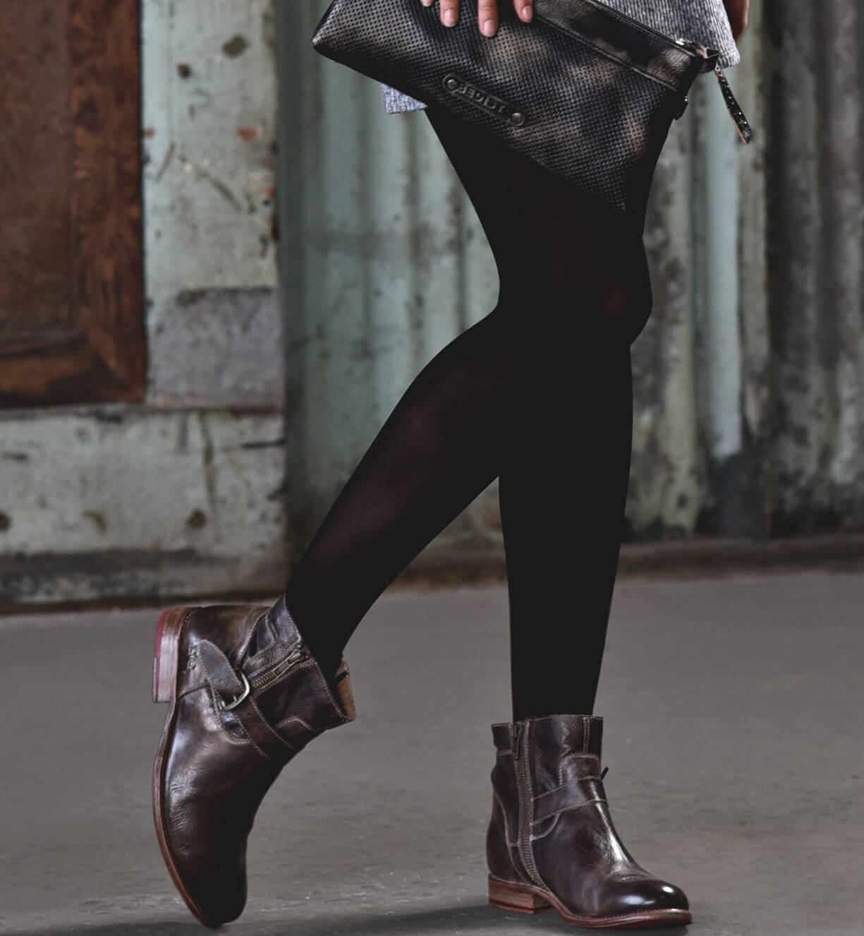 A woman wearing a pair of Bed Stu Becca leather boots.