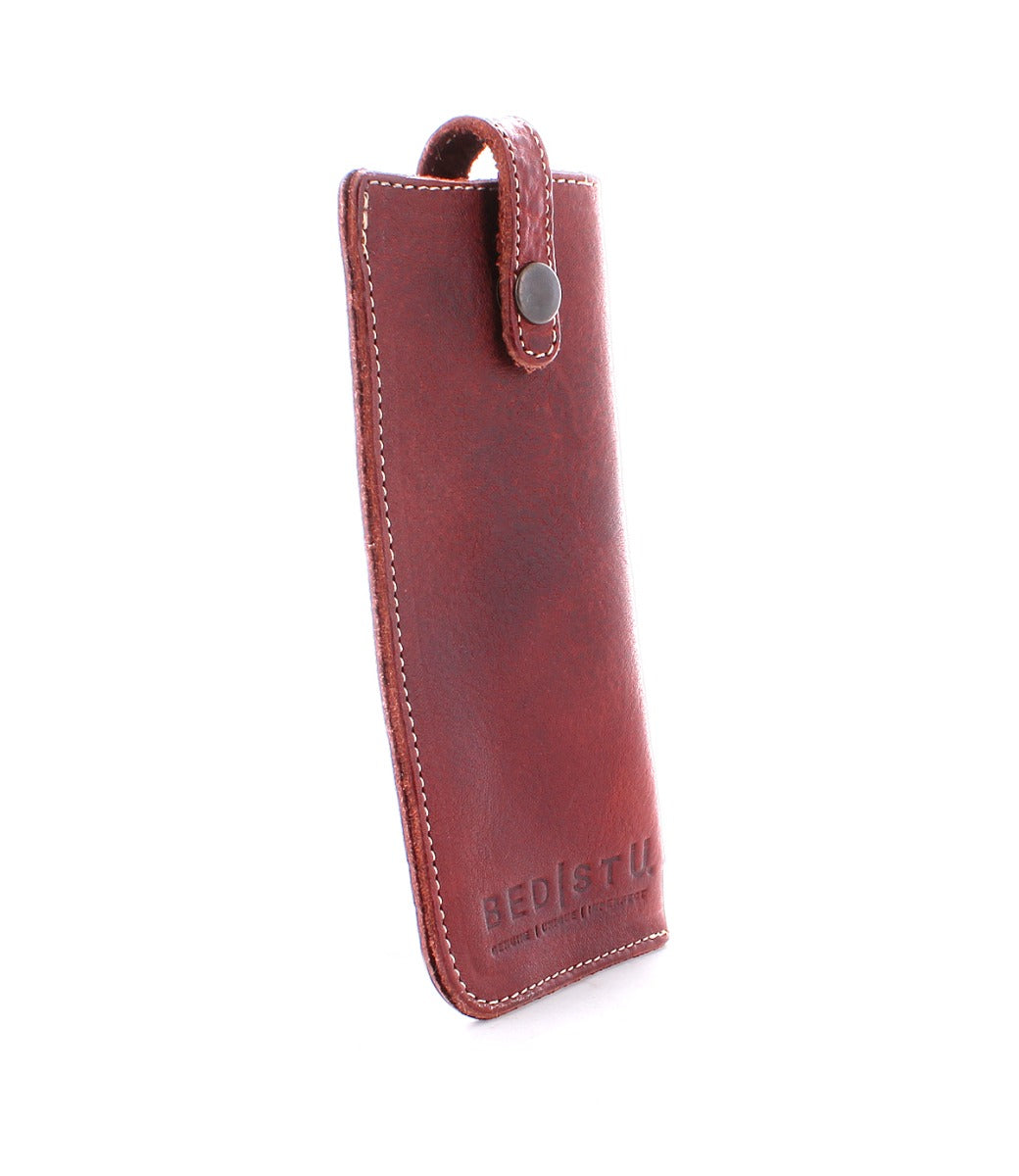 An image of a red leather Bed Stu Behold phone case.