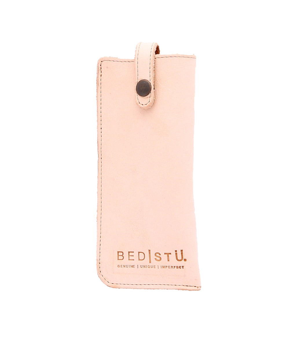 A pink leather Behold case with the word Bed Stu on it.