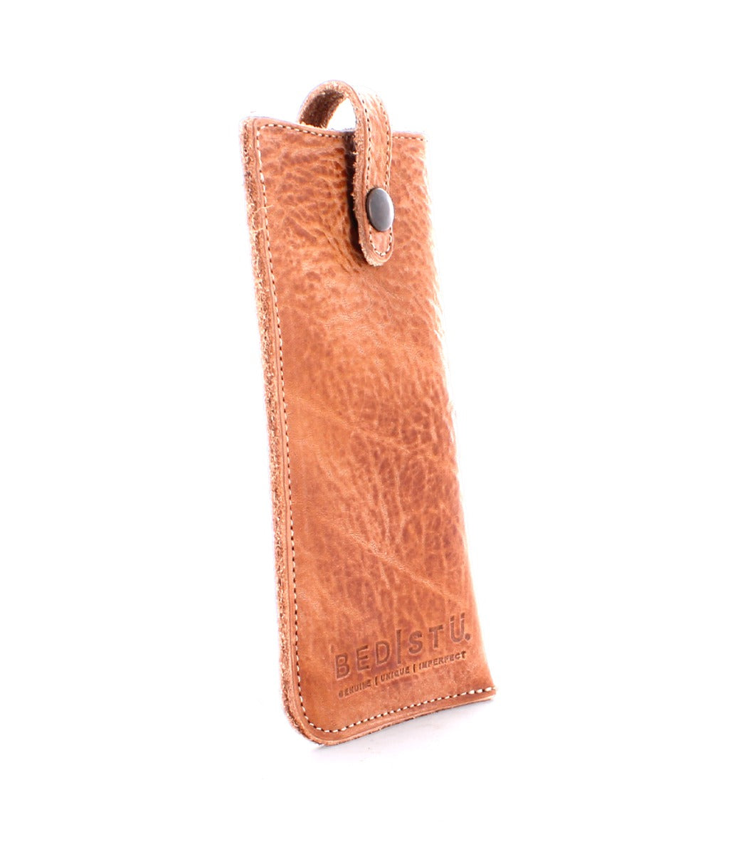 A Behold leather phone case by Bed Stu on a white background.