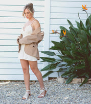 A woman wearing a Bellatrix II women's white sandal by Bed Stu.