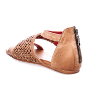 A women's tan sandal with a woven strap, the Bellatrix II by Bed Stu.