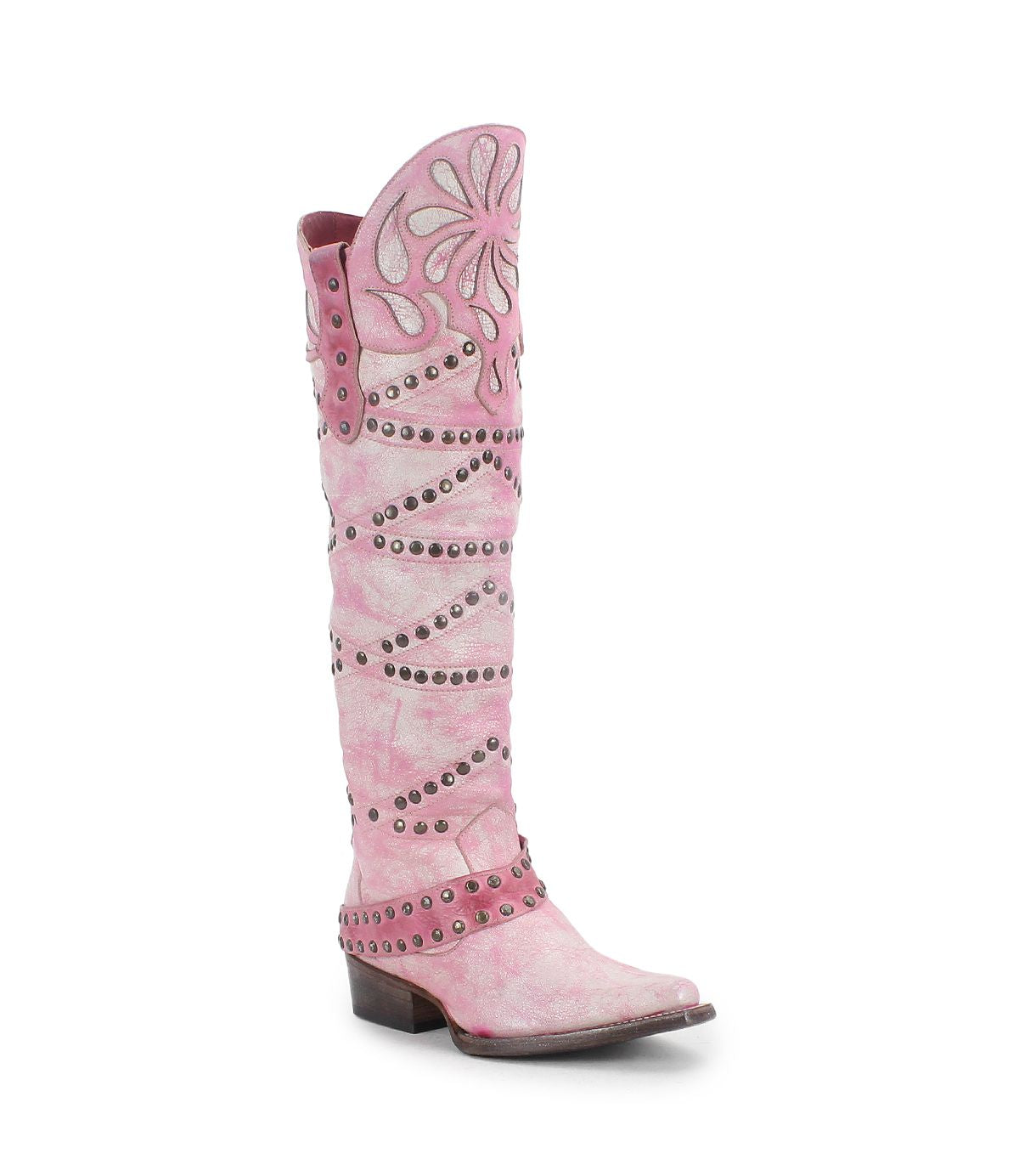 The Bed Stu "Betting" boot is a tall pink Western-style boot with floral cutouts, studded details, and a low heel made from vegetable-tanned leather.